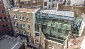 Office refurbishment in Central London creates a glass two-storey extension to connect two buildings