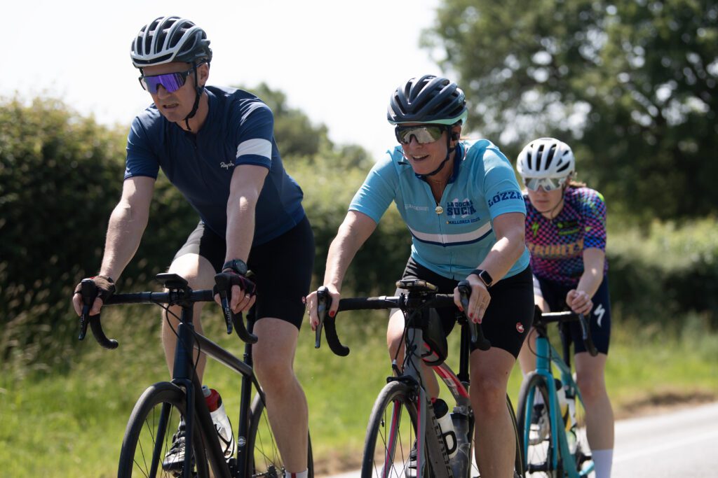 Workman with client on bikes